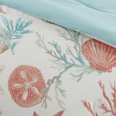 the bedding is made up with coral and seaweed print on it's sheets