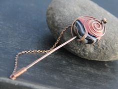 "ATTENTION  I am going to be out of the studio EVERY WEEKEND from Friday to Monday.  All orders placed Friday to Sunday are going to be processed and shipped following Tuesday and Wednesday, so please, plan accordingly. Pretty stick shawl pin with focus on large 1\" or 2.5 cm round bi-colored agate. Nice pink and black striped agate is truly a centerpiece! Please note, each stone will have unique pattern, no two a going to be exactly alike. Pin is just under 4\" or 10 cm long with hand made cap Wind Rose, Sweater Pin, Shawl Pin, Scarf Pin, Diy Wire Jewelry, Wire Work Jewelry, Shawl Pins, Turquoise Howlite, Rose Earrings