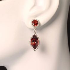 Sparkling Garnet & Zircon Earrings – Perfect for the Holidays and Beyond Brighten your life with these stunning red garnet earrings, designed to grace your ears with elegance and sparkle! These spectacular earrings are ideal for the holiday season or any special occasion, adding a touch of luxury and festive cheer.  Key Features: Genuine Garnet & Zircon Gemstones: The earrings feature round red garnets sitting on the ear, complemented by dangling bright red Mali Garnets below, with a sparkling Zircon accent in between. Both garnets are framed by brilliant-cut genuine Zircons, creating a lively and dazzling effect with every movement.  Handcrafted Sterling Silver Settings: These handmade sterling silver earrings are crafted with care, showcasing the natural beauty of the gemstones while ens Mali Garnet, Red Garnet Earrings, Red Jewel, Zircon Earrings, Jeweled Earrings, Garnet Earrings, Red Earrings, Red Garnet, Handmade Sterling Silver