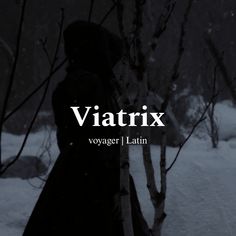 a woman standing next to a tree in the snow with text that reads vitatrix