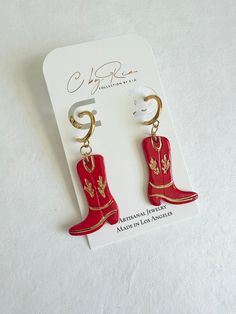 These Western inspired cowboy boots feature a gold plated stainless steel huggie hoop attachment, giving them a unique and stylish touch. Perfect for any fashion-forward individual seeking to add a touch of western charm to their wardrobe. Cowboy Jewelry, Cowboy Boot, Artisan Jewelry, Uganda, Cowboy Boots, Fashion Forward, Cowboy, Stainless Steel, Wardrobe