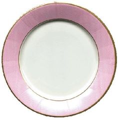 a pink and white plate with gold trim