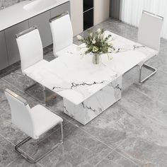 a marble dining table with white chairs and flowers in vase on the top, surrounded by grey tile flooring