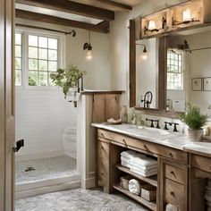 a bathroom with double sinks and wooden cabinets