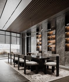 an elegant dining room with marble walls and flooring, along with built - in shelving