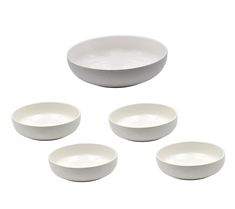 four white bowls with one empty bowl on the side