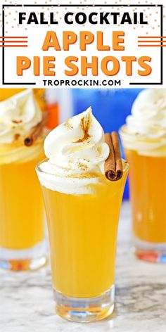 two glasses filled with apple pie shots on top of a table