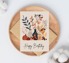 a happy birthday card with flowers and pumpkins on it next to cotton floss