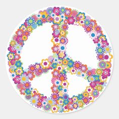 a peace sign made up of colorful flowers on a white sticker with the word peace written