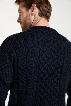 A symbol of Ireland past and present, the Inisheer Traditional Aran Sweater is a timeless addition to your wardrobe. Made with 100% Merino wool, the quality of this authentic Irish gem cannot be rivalled, its is a true Irish hero Aran piece. Much like its namesake, the Inisheer Aran Sweater captures the essence of Ireland in all of its glory. With a beautiful combination of traditional Aran stitches such as honeycomb, moss and cable, this piece is inspired by the past while remaining firmly rooted in the present. Comfortable, sustainably made and thoughtfully crafted. Model Wears: Male Height: 6ft 2inches Wearing: M Classic Wool Outerwear With Fair Isle Pattern, Aran Stitches, Wool Sweater Men, Men's Knitwear, Aran Sweater, Homewares Shop, Cable Sweater, Past And Present, Yarn Shop