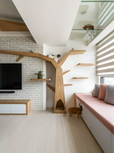 a living room filled with furniture and a flat screen tv on top of a wooden shelf