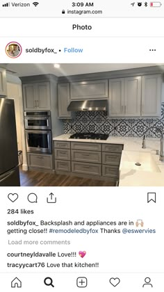 an instagramted photo of a kitchen with gray cabinets