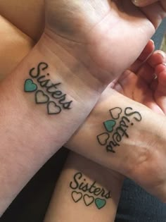 two girls with matching tattoos on their wrists that say sister and sister's