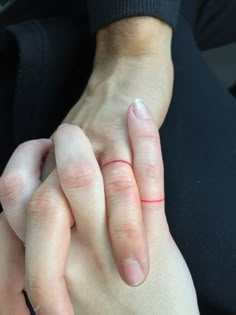 someone is holding their hands together in the middle of an instagramtion with another person's hand