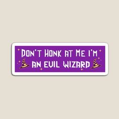 a purple sticker that says don't honk at me i'm an evil wizard