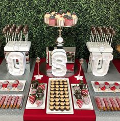 desserts and sweets are displayed on the table for guests to eat at an event