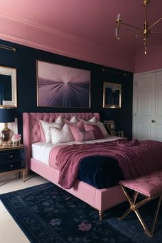 a bedroom with pink and blue walls, gold accents