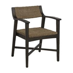 the arm chair is made from wood and has a woven seat pad on top of it