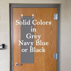 a door with the words, solid colors in grey navy blue or black on it