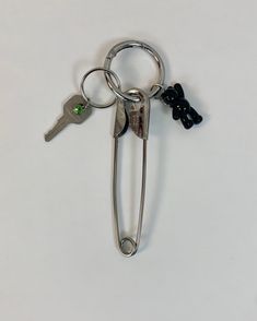 Made to order jumbo steel 5” safety pin with a carabiner, puffy black acrylic teddy bear, vintage key, crystal charm and an o-ring to attach to anything. Vintage key and crystal charm will vary depending on what is available. If you have a color request add it in the notes at checkout. Designed and hand crafted in house by us with lots of love. *Please allow up to 10 days to produce as its a made to order piece, although orders are generally ready within 1-2 days. Email us with any questions:) Safety Pin Keychain, Pin Keychain, Teddy Bear Vintage, Carabiner Keychain, Vintage Key, Vintage Keys, Family Affair, Black Acrylic, Black Acrylics