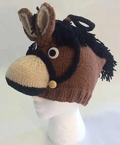 a knitted hat with a horse's head on it