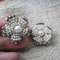 "Haskell Style Costume Fashion Earrings, Japan Stamp, Clip Back, On the Ear Earrings. 1950's Flower Costume Pearl, Rhinestone Earrings Clips, they are delicate, wire wrapped, clips stamped \"Japan\". True vintage, faux pearls with little prong set rainbow aka aurora borealis rhinestones, post 1958 in age. Handle with care. Lightweight, fair quality.  25.5 MM or 1 IN across  1958 to 1965 time period  Ever so slightly as is, open clips carefully, they work and have good tension.  Lightweight  Very Haskell in style" Vintage Flower Earrings, Vintage Pearl Earrings For Party, Vintage Pearl Earrings For Wedding, Vintage Jeweled Earrings For Gifts, Vintage Flower Jewelry For Party, Vintage Flower Shaped Jewelry For Anniversary, Vintage Flower Earrings For Wedding, Vintage Flower Earrings For Formal Occasions, Vintage Cluster Earrings For Wedding