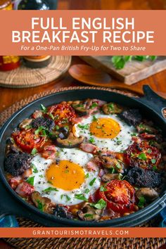 an english breakfast with fried eggs and tomatoes in a skillet on a wooden table