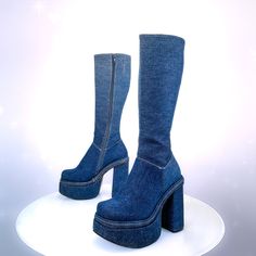 "Vintage 90's chunky Blue jean ankle boots with a side zipper. Thick denim blue Jean uppers and heel with gold stitching just like jeans.They are in excellent vintage condition and seem unworn. Super sturdy platform and heel with rubber soles.  These seem unworn and in perfect condition, soles have no wear. Size 6 Womens US Insole: 9.25\" Width:3.5\" 5.5\" Heel 2\" Platform Total height: 19\" Calf: 12.5\" -13.5\" with stretch panel" Trendy Denim Knee-high Boots, Trendy Knee-high Denim Boots, Trendy Denim Blue Round Toe Boots, Casual Fitted Platform Boots For Streetwear, Trendy High Ankle Denim Boots, Blue Boots For Spring Streetwear, Blue Boots For Streetwear In Spring, Blue Jean Heels, Jean Heels