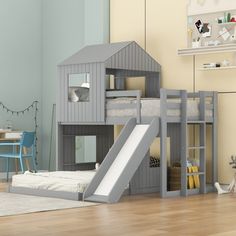 a child's bedroom with a bunk bed and slide