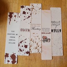 five bookmarks that have been altered to look like they are covered in brown and white paint