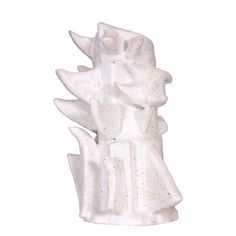 a white ceramic sculpture sitting on top of a table