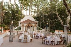 an outdoor dining area with tables and chairs set up for a formal function at the resort