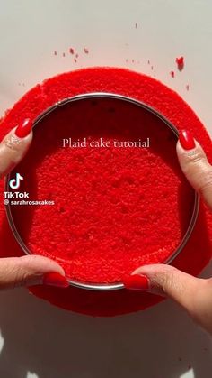 two hands holding a red bowl with cake in it and the words plad cake tutor above it