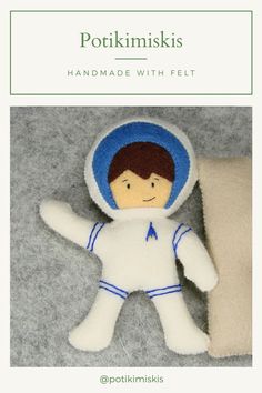 an image of a stuffed toy that is in the shape of a man wearing a space suit