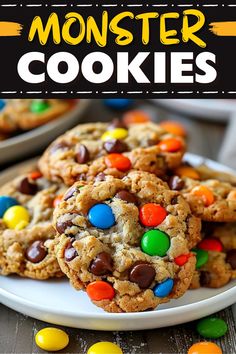 monster cookies on a white plate with m & m's in the background and text overlay