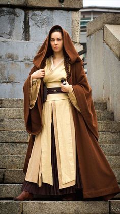 a woman dressed in a star wars outfit standing on steps with her hand on her hip