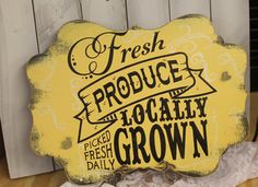 a sign that says fresh produce and locally grown