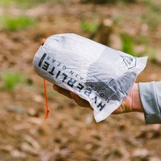 a person holding a plastic bag in their hand with the words herschel on it