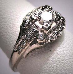 a close up of a ring with diamonds on it