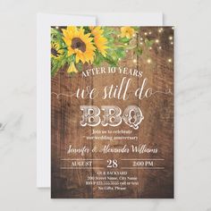 sunflowers and string lights are on the wooden background in this rustic wedding card