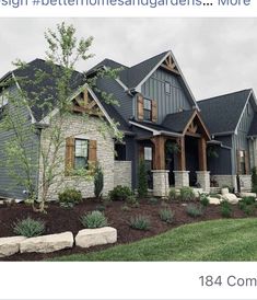 the front of a house with landscaping in front of it and an advertise