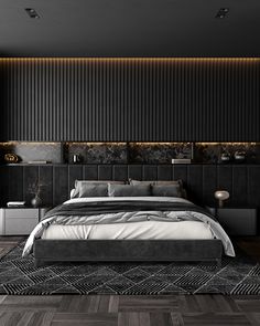 a modern bedroom with black walls and wood flooring is pictured in this image, the bed has an upholstered headboard