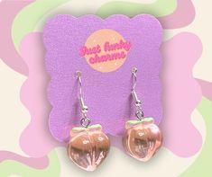 Delightfully fresh and vibrant, these handmade peach fruit earrings bring a burst of color and charm to any outfit. Each piece captures the essence of a juicy, ripe peach with its warm, rosy tones and delicate shape. The realistic design, complete with a tiny green leaf accent, adds a playful yet elegant touch, making these earrings perfect for fruit lovers and anyone who enjoys unique, statement accessories. Lightweight and eye-catching, they are ideal for adding a pop of fun to your everyday s Peach Earrings, Peach Fruit, Fruit Earrings, Earrings Handmade, Everyday Fashion, Jewelry Earrings Dangle, Dangle Earrings, Jewelry Earrings, Fruit