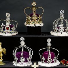 several crowns are sitting on display together