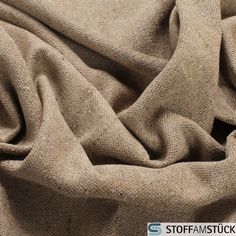 a close up view of a tan fabric