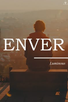 a person sitting on top of a bench with the words enver above them and below it