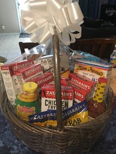 a basket filled with lots of food sitting on top of a table