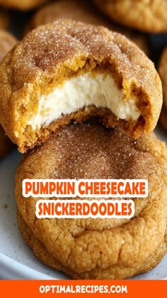 two pumpkin cheesecake snickerdoodles on a plate with the words, pumpkin cheesecake snickers