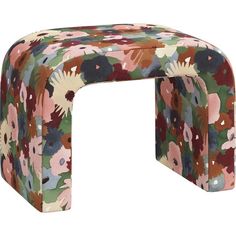 an upholstered bench with colorful flowers on the front and back sides, made out of fabric