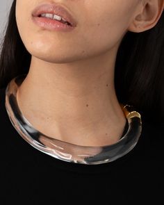 Sculpted crystal clear Lucite collar, modern in form. Capped with 14k gold plated hinged end cap. 14k gold plated brass, Lucite Lucite is hand-carved and hand-polished in Brooklyn, NY Modern Round Lucite Jewelry, Formal Gold Lucite Jewelry, Clear Luxury Jewelry For Formal Occasions, Luxury Clear Jewelry For Formal Occasions, Formal Clear Jewelry With Polished Finish, Formal Clear Lucite Jewelry, Elegant Lucite Jewelry For Formal Occasions, Lucite Jewelry, Acrylic Jewelry